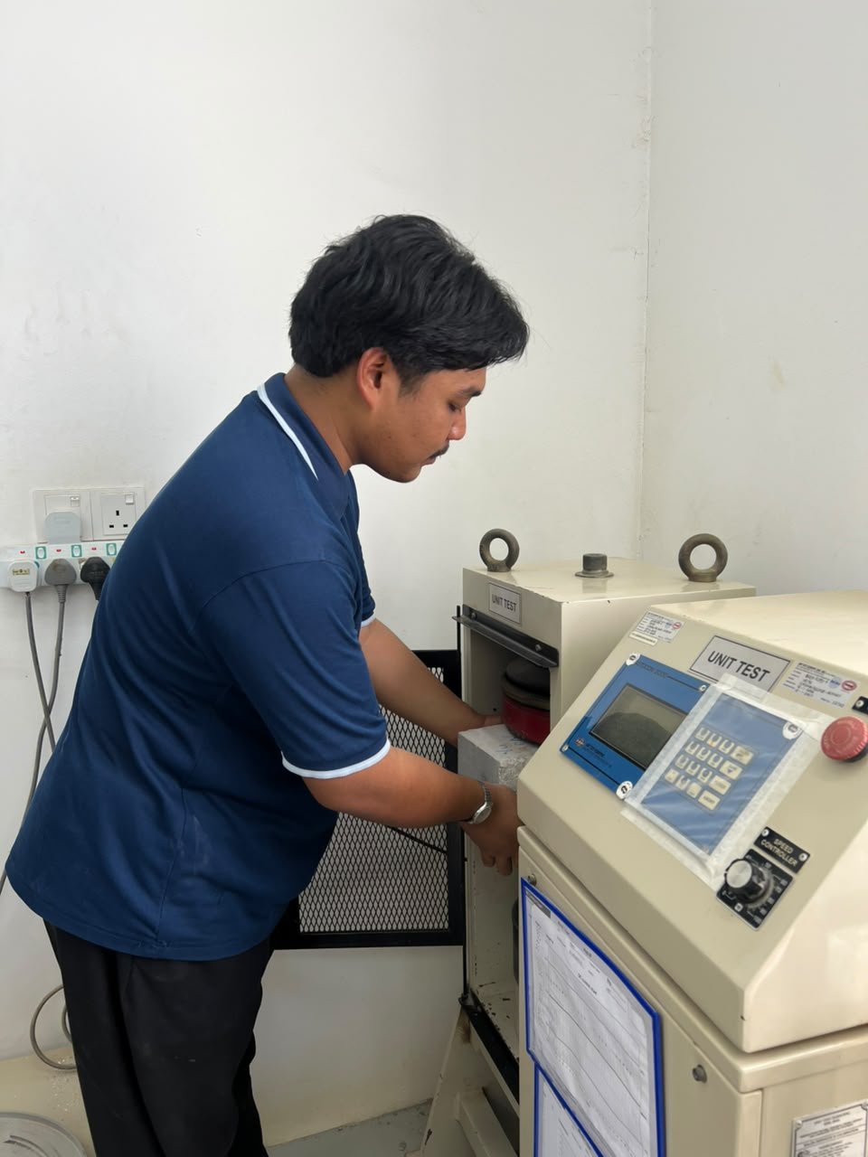 ARCHITEST technician carrying out concrete testing